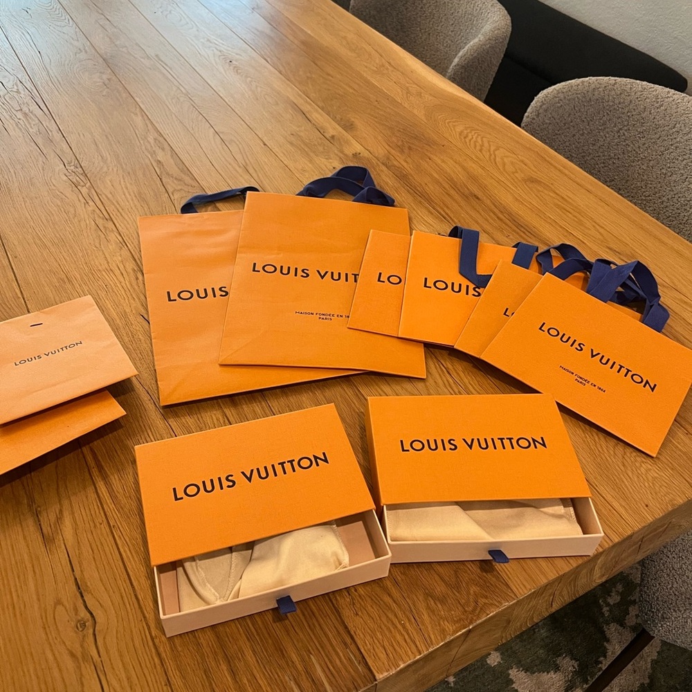 Various authentic Louis Vuitton bags and boxes